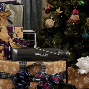 Sun Kettle XL on top of gifts by a Christmas tree