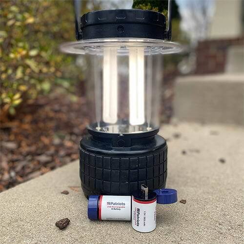 4Patriots USB-Rechargeable D Battery Kit next to a lantern
