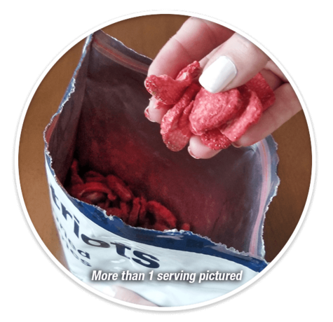 Hand pulling out Freeze-Dried Strawberries from pouch