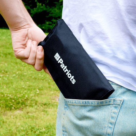 Person putting the PocketSun Solar Panel in their pocket