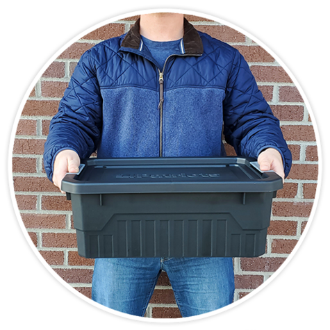 man holding stackable storage tote 