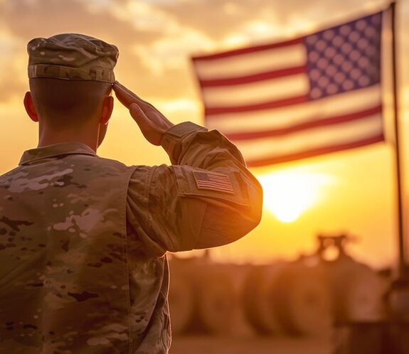 A US soldier saluting the American Flag