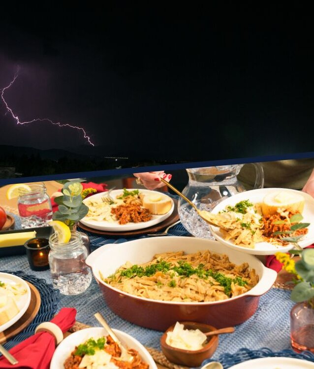  A family eats a meal prepared from the 4Patriots 3-Month Emergency Survival Kit during a blackout.
