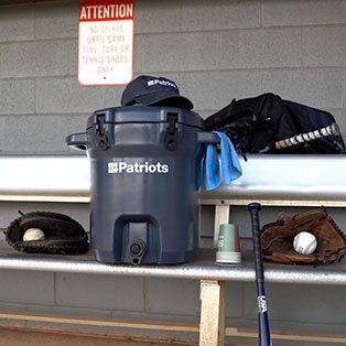 An Outdoor Water Filtration System sitting in the stands, ready to use at a baseball game.