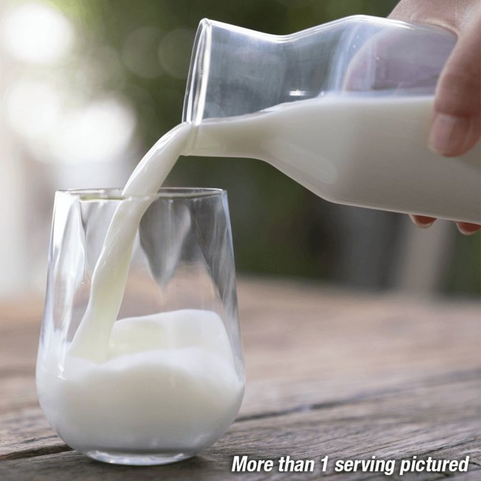 Heartland's Finest Powdered Milk being poured into a glass