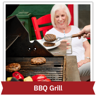 Woman sitting outside watching someone flip burgers on a BBQ grill