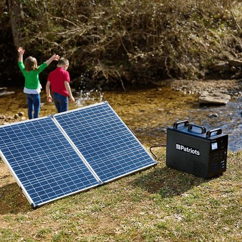 Solar panel plugged into Patriot Power Generator outside using sunlight to power