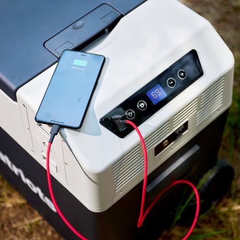 4Patriots Solar Go-Fridge charging a cell phone outside