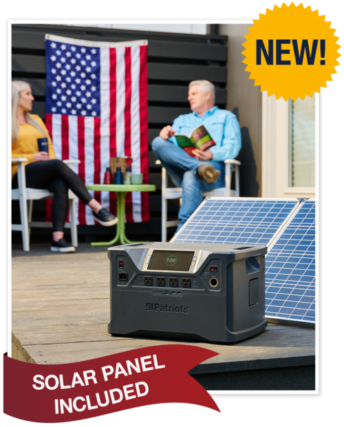Woman and man sitting outside with the Patriot Power Generator 2000X and solar panel in front of them.
