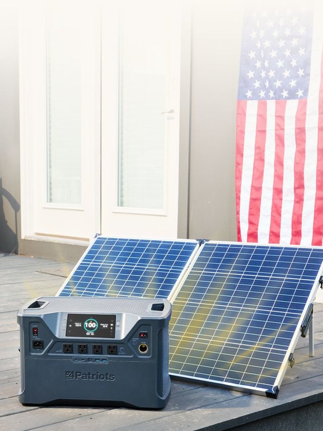 Patriot Power Generator 2000X charging in the sun on a back porch.