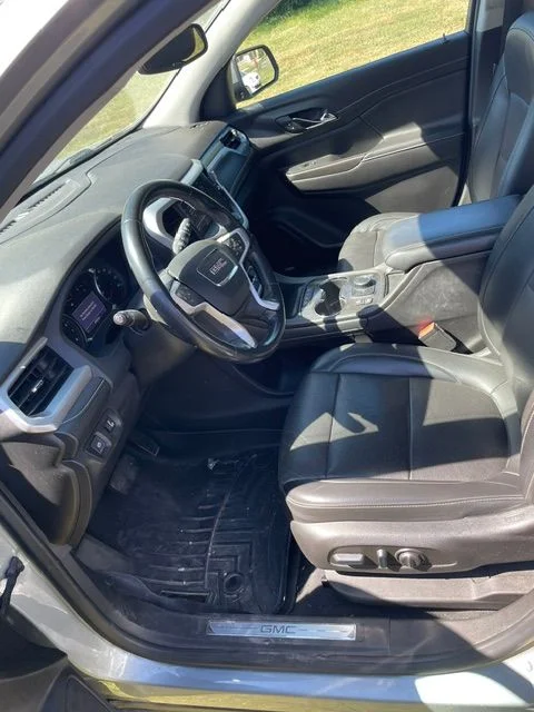 Clean GMC SUV interior with detailed driver seat and console