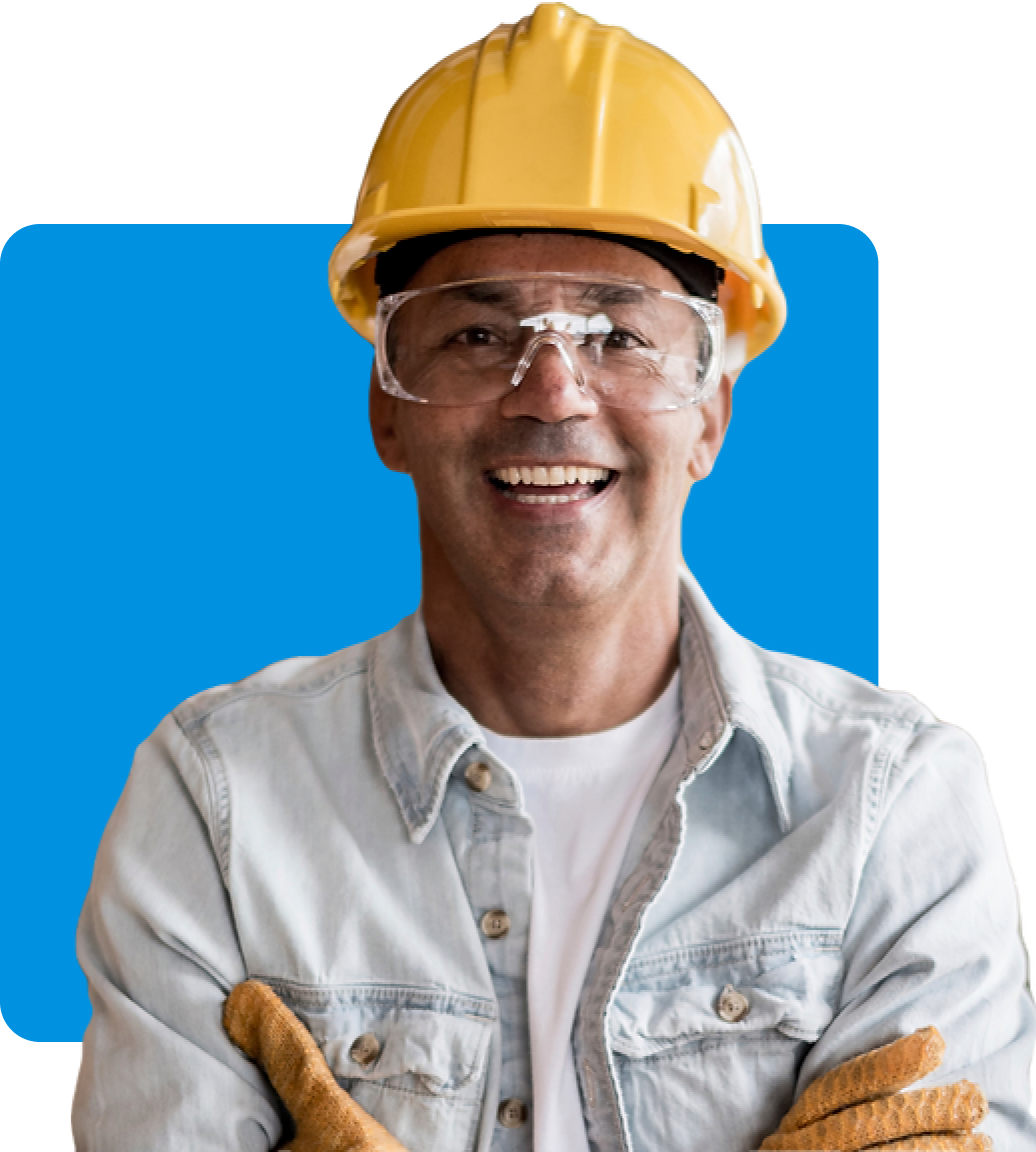 A smiling construction worker with their arms crossed over their chest wearing a yellow hardhat, underlaid by a bright blue square.