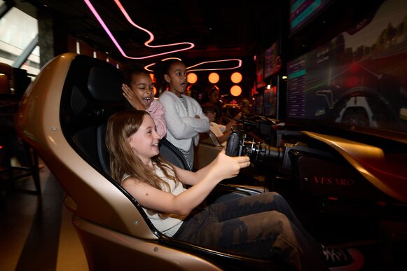 Guest enjoying Sim Racing at F1 Arcade