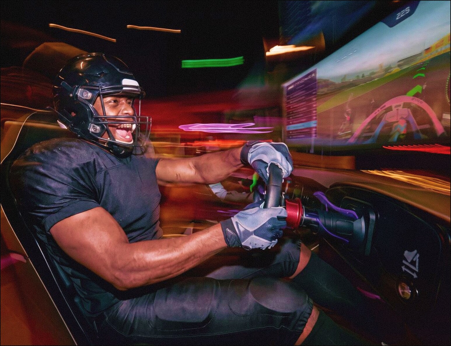People in F1® Arcade laughing as they race