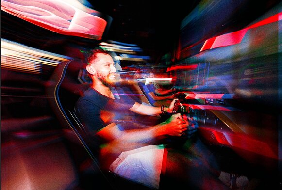 Guest racing on an F1® Arcade simulator at Sprint Social