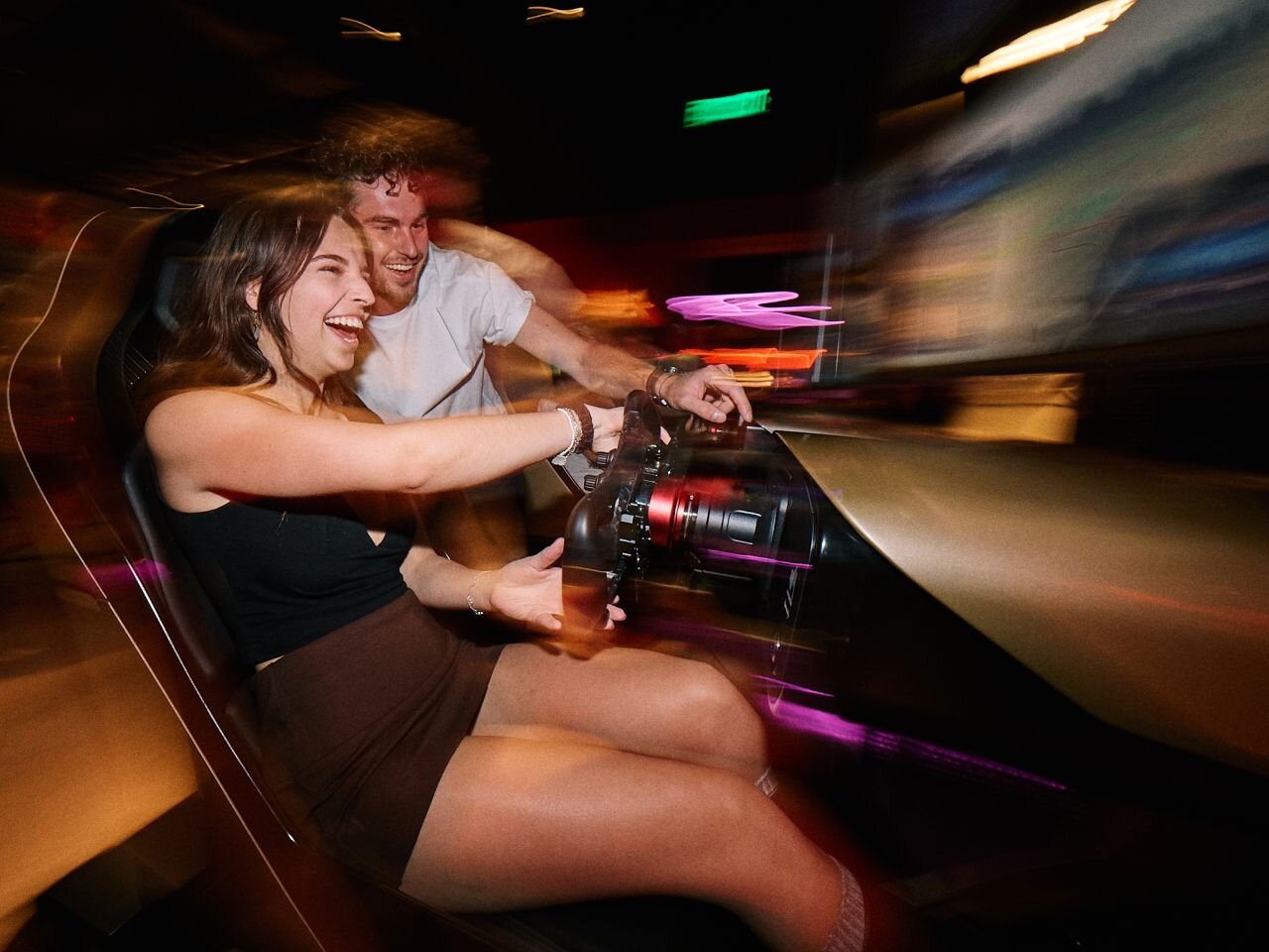 People enjoying racing at F1 Arcade