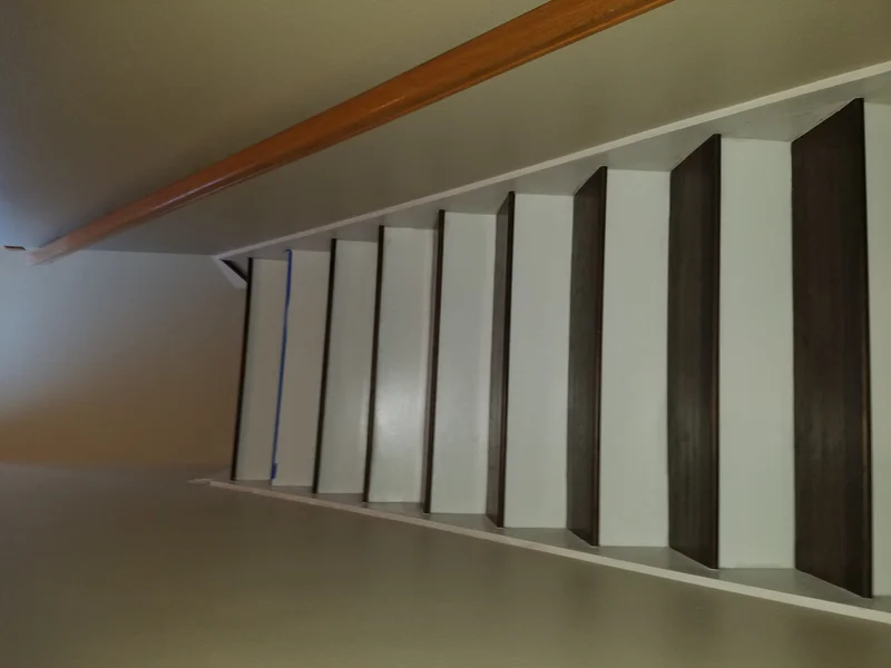 Detailed custom staircase renovation with wood trim