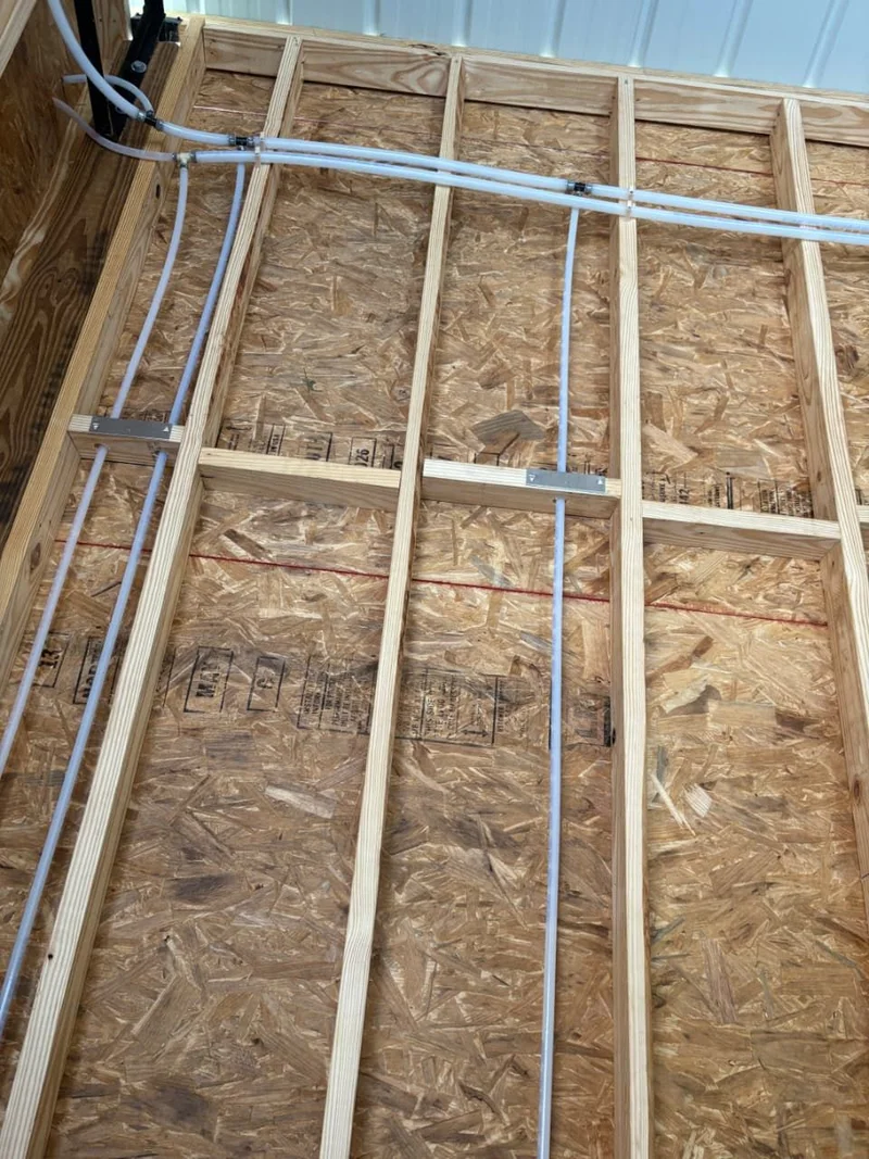 Building framing with plumbing rough-in