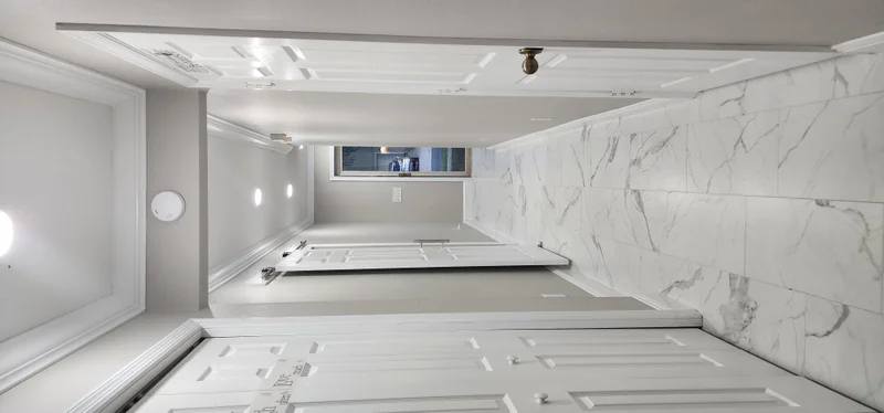 Bright white interior renovation with custom doors and trim