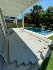 Paver pool deck and landscaped backyard