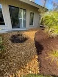 Fresh mulch bed beneath a home's front windows