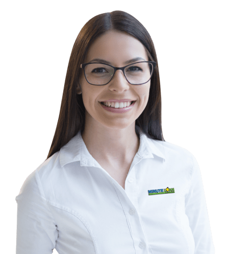 Smiling Minute Loan Center employee in white branded shirt and glasses — financial services careers