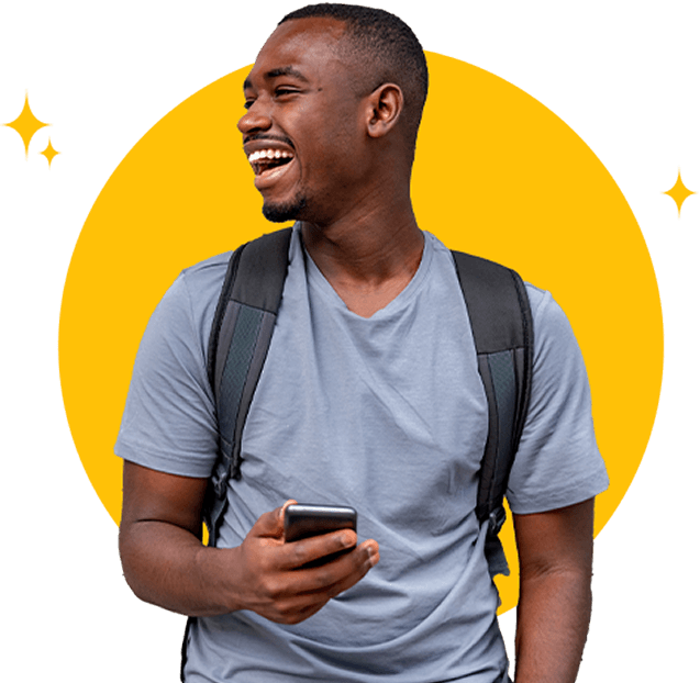 Excited man in t-shirt holding a cell phone