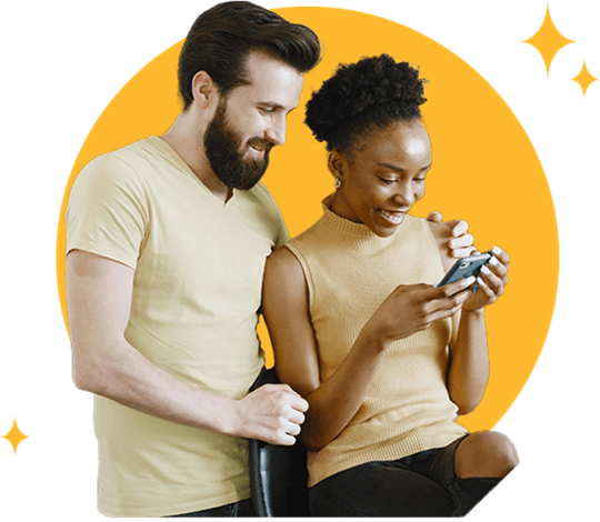 Smiling man and woman reviewing online loans in Louisiana on a mobile phone.