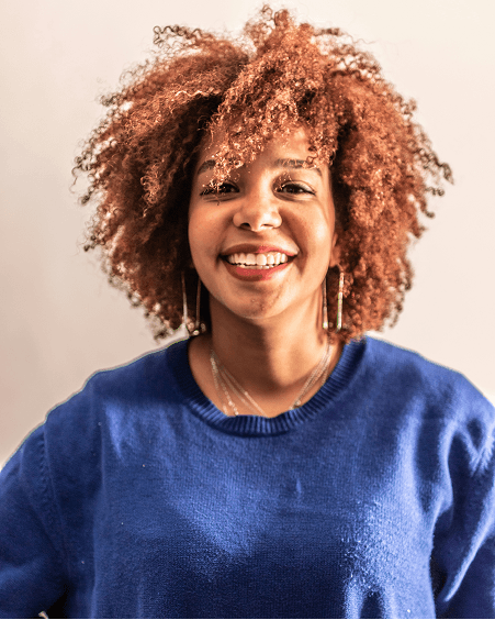 Woman with curly hair smiling