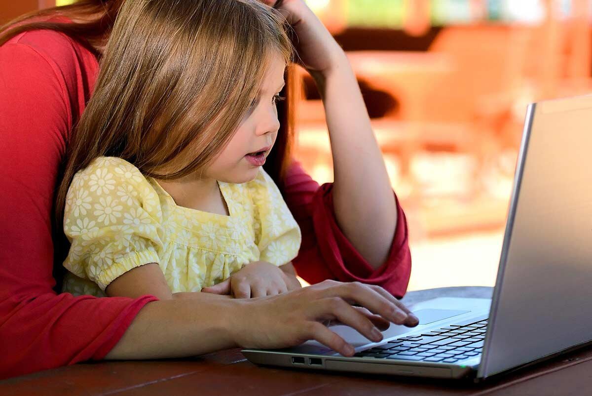 Parent teaching a young child about financial success