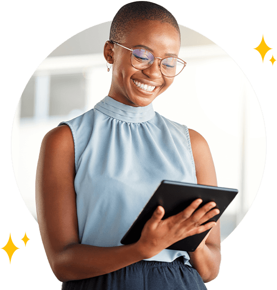 Happy young woman using a tablet to apply for a personal loan.