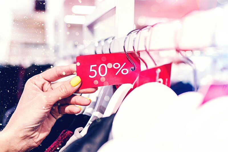 50% discount tag on clothes in a store.