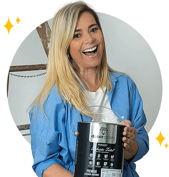 Smiling woman holding a paint can