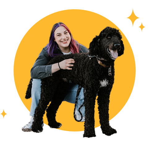 Young woman with her black poodle in Milwaukee, Wisconsin.
