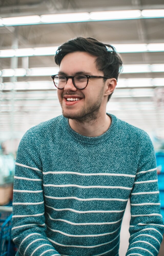 Man smiling looking away