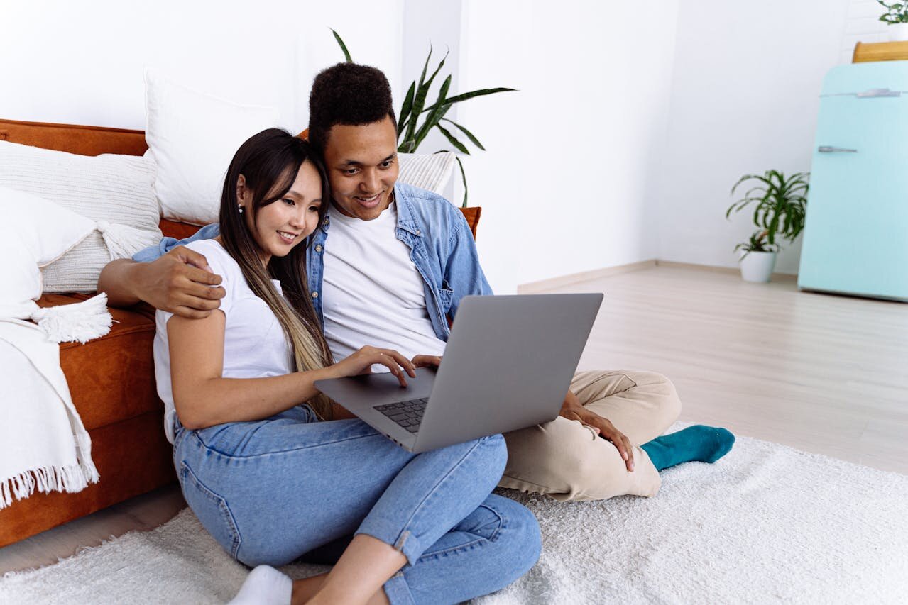 Smiling woman using tablet to apply for a personal installment loan.