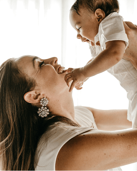 Woman holding baby up