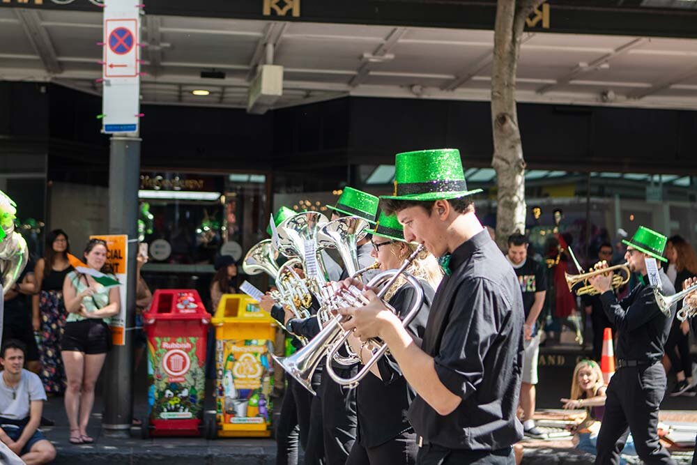 A band playing in a parade on St. Patrick’s Day