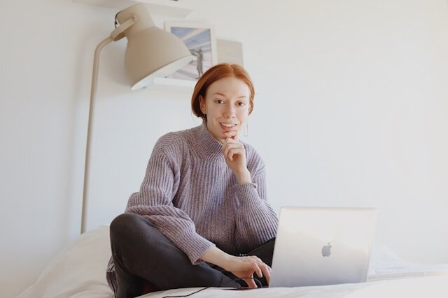 Young woman applying for an installment loan from a computer