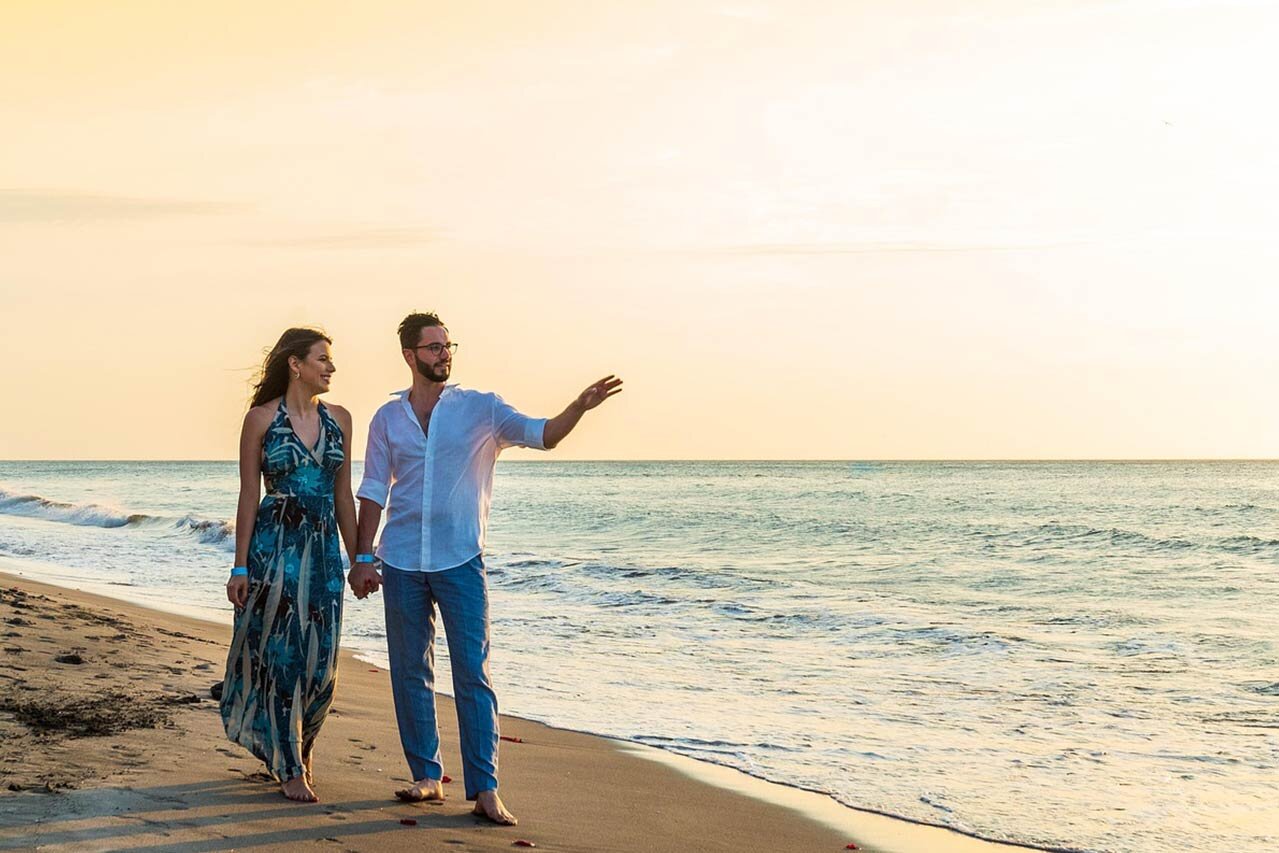 Couple on vacation walking on the beach
