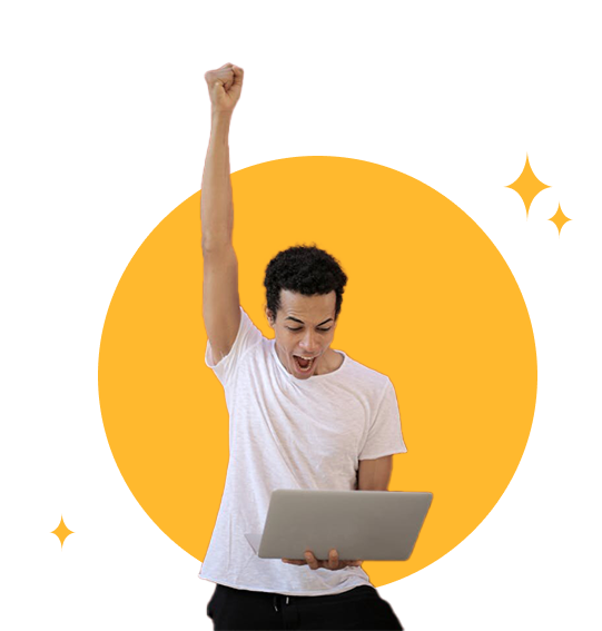 Man with laptop celebrating approval for South Carolina personal loan