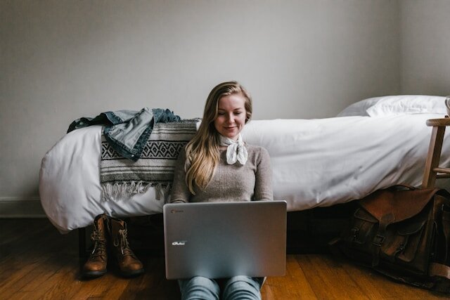 Smiling woman reviewing installment loan approval.