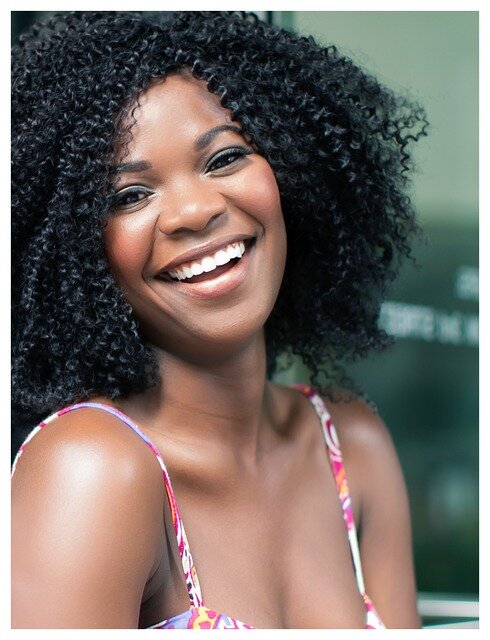 Close-up of a smiling woman.