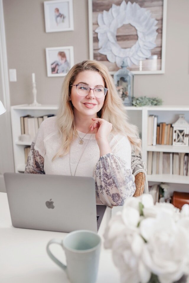 Woman seated at a desk with a laptop