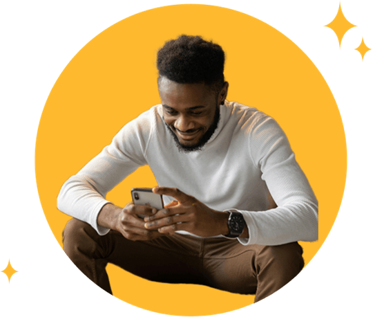 Smiling man reviewing Wisconsin personal loan options on his smartphone.
