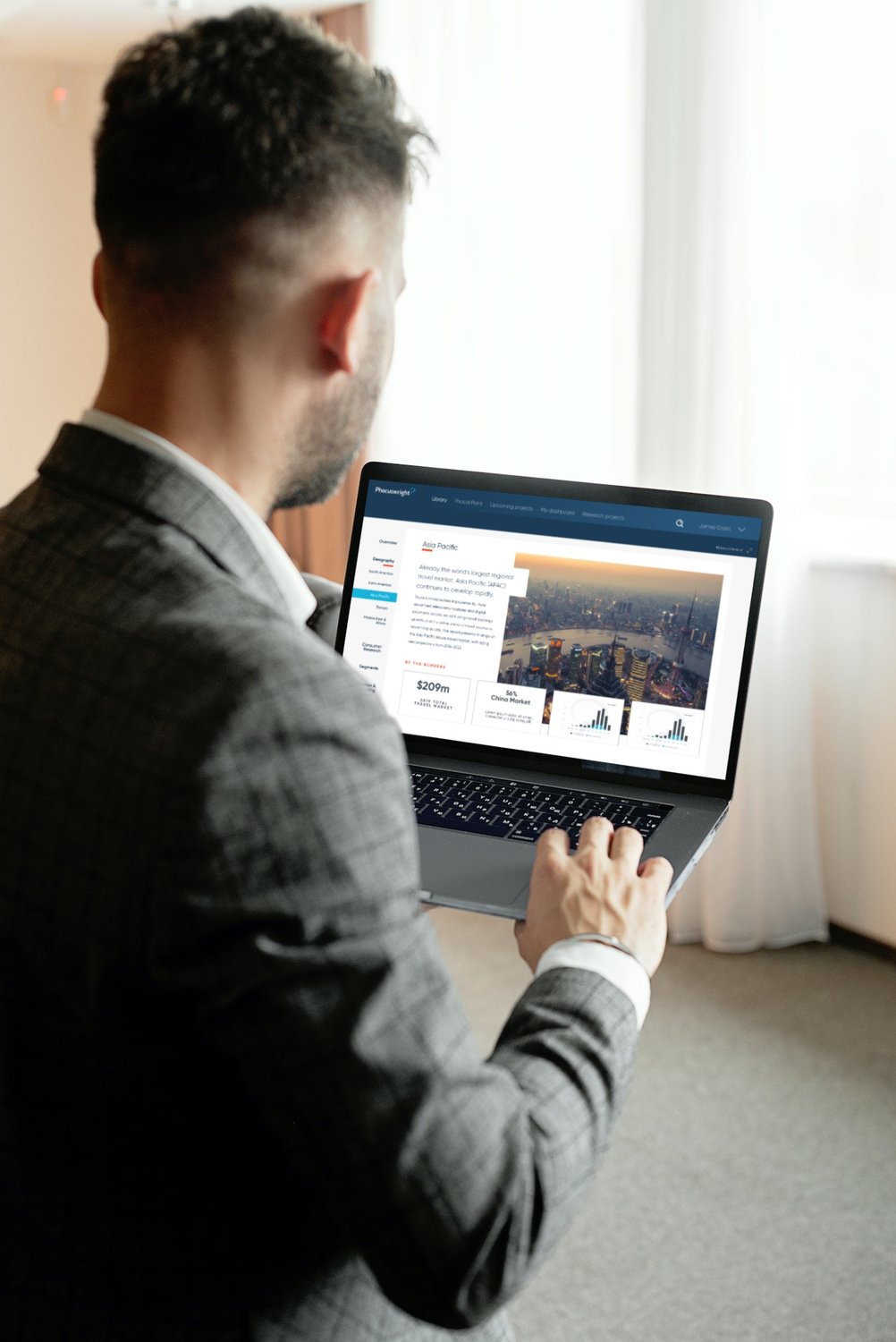 Over shoulder view of user on Phocuswright website
