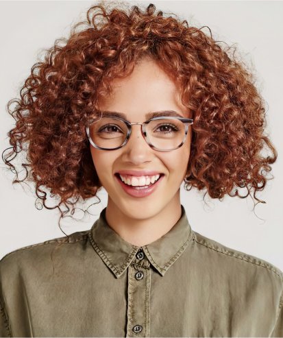 woman wearing round light tortoiseshell designer glasses