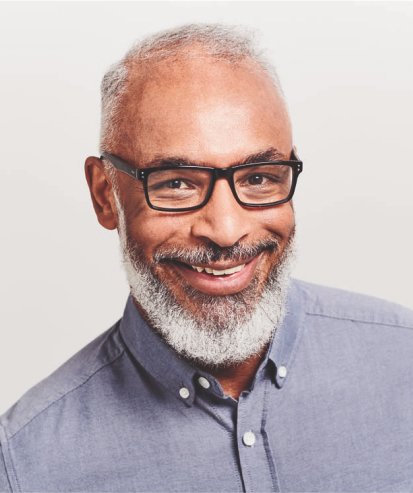 mature man wearing black, acetate rectangular glasses