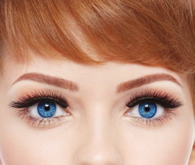 a woman wearing blue coloured contact lenses