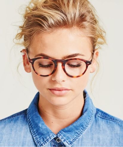 woman wearing luxury designer glasses